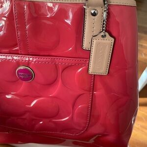 COACH Signature embossed patent leather handbag